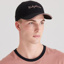 A front view of a man wearing a black Ridgeline signature cap