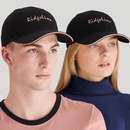 A front view of a man and woman wearing a black Ridgeline signature cap