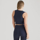 Back view of the navy cropped sports top and matching shorts, showing the smooth, streamlined fit and racerback-style cut.