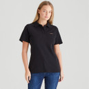 Front view of a woman wearing a black short-sleeve polo shirt with a collar and button placket. A small embroidered Ridgeline logo appears on the left chest. She pairs it with blue jeans against a plain light grey background.