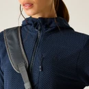 Close-up of the navy textured jacket showing the zip fastening, hood neckline and zipped chest pocket detail.