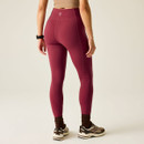 Rearview of model wearing Tibetan red high-waisted leggings.