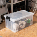 70L clear storage box used for organising cables and hardware in a garage setting.