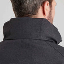 Close-up of the high collar and hood seam on a dark charcoal waterproof jacket, highlighting the fabric texture.
