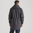 Back view of a dark charcoal waterproof hooded jacket showing the relaxed longline fit and elasticated waist detail.