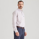 Side view of men’s white Sedgebrook check shirt with brown and navy grid pattern, styled with navy trousers.