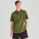 Men’s green short-sleeve polo shirt worn by a model, featuring a classic collar and subtle embroidered branding on the chest.