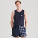 Man wearing a navy Ridgeline tank top paired with navy two-tone shorts split between solid navy and houndstooth print.