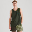 A model wearing a dark green Ridgeline sleeveless singlet with contrast green trim and small chest logo, paired with light-and-dark green two-tone shorts featuring a houndstooth-style pattern on one side.