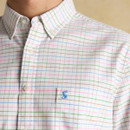 Close-up of shirt sleeve showing contrast inner cuff and Joules script branding on a men’s Oxford shirt.