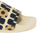 Cream slide sandal with wide strap featuring navy geometric squares and tan floral print.