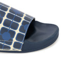 Close-up of Orla Kiely x Regatta slide sandal showing cushioned navy footbed and patterned strap.