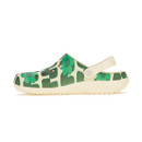 Left side view of cream clogs with green flower print and lightweight sole