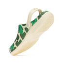 Cream clogs showing textured sole and adjustable heel strap from below