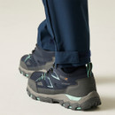 Back view of navy walking shoes worn with outdoor trousers, showing padded heel and grip sole.