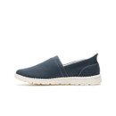 Profile view of navy slip-on canvas shoe on white background