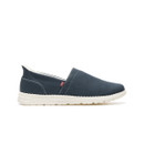 Side view of navy slip-on shoe with cushioned white midsole