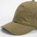 Close-up of the olive green Barbour cap, showing the embroidered logo and stitched curved peak.