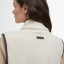 Close-up of the back of the gilet showing the leather Barbour logo patch below the collar.