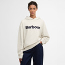 Model wearing an off-white Barbour logo hoodie with dark blue lettering, paired with dark indigo jeans.