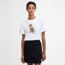 Model wearing white Barbour short-sleeve T-shirt with front dog graphic print, paired with a black mini skirt.