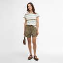 Full-length view of the striped T-shirt and khaki shorts outfit, styled with brown sandals and a small shoulder bag.