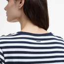 Back neck close-up of the striped Barbour T-shirt showing the branded metal badge.