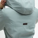 Close-up of the back of the jacket, showing the Barbour logo patch beneath the hood on the pale blue jacket.