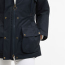 Close-up of navy Barbour jacket front pocket with popper studs and embroidered logo detail.