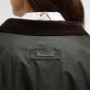 Close-up of back neck, showing small Barbour badge below the corduroy collar.