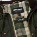 Inside view showing Barbour tartan lining with branded label and “Lightweight 4oz Wax” tag.