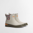 Cream Barbour Chelsea wellington boots with leopard print elastic panels and contrast orange heel detail, shown at a three-quarter angle.