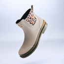 Barbour cream Chelsea wellington boot shown in a dynamic floating pose, featuring leopard print elastic panels, pull tab heel, durable rubber construction and contrast sole.