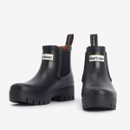 Front view of black Barbour Chelsea wellington boots featuring a rounded toe, deep tread sole and Barbour logo badge on the upper.