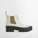 Side view of cream Barbour Chelsea boots with elasticated panel and deep lug outsole.