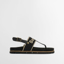 Side view of black Barbour logo sandals with flat sole, contrast midsole trim and thong-style front.