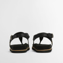 Rear view of black Barbour sandals displaying ankle straps, heel support and flat outsole.