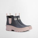 Pair of Barbour navy Chelsea wellington boots with blush pink chunky soles and elastic side panels on a white background.
