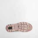 Sole view of a Barbour Chelsea wellington boot featuring a blush pink rubber outsole with deep tread pattern.