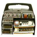 A black rotary tool accessory kit with multiple compartments holding sanding discs, polishing wheels, brushes, and bits, organized neatly for easy access.