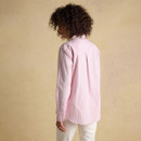 Rear view of a pink striped women’s shirt with long sleeves and a classic collar, shown on a model against a beige backdrop.