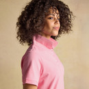 Side profile of a pink Joules polo shirt on a model, showing short sleeves, tailored fit and classic polo collar.