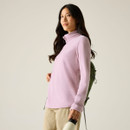 Model wearing a lilac long-sleeve half-zip fleece with a high collar, shown from the side