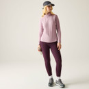 Full-length view of the model in a lilac half-zip fleece top with leggings and walking shoes.