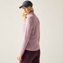 Rear view of the model wearing the lilac half-zip fleece top.