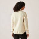 Back view of a model wearing the light vanilla full-zip fleece jacket, showing the stand collar and curved hem.
