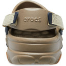Rear view of khaki Crocs clog showing padded heel strap with embossed Crocs logo.
