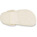 Outsole view of gold glitter Crocs Children's Classic Clog displaying tread pattern and Crocs logo.