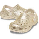 Gold glitter Crocs Children's Classic Clog with cream heel strap, shown at a three-quarter angle on a white background.