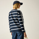 Back view of model wearing the navy-and-white striped long-sleeve top, showing the rear stripe pattern.